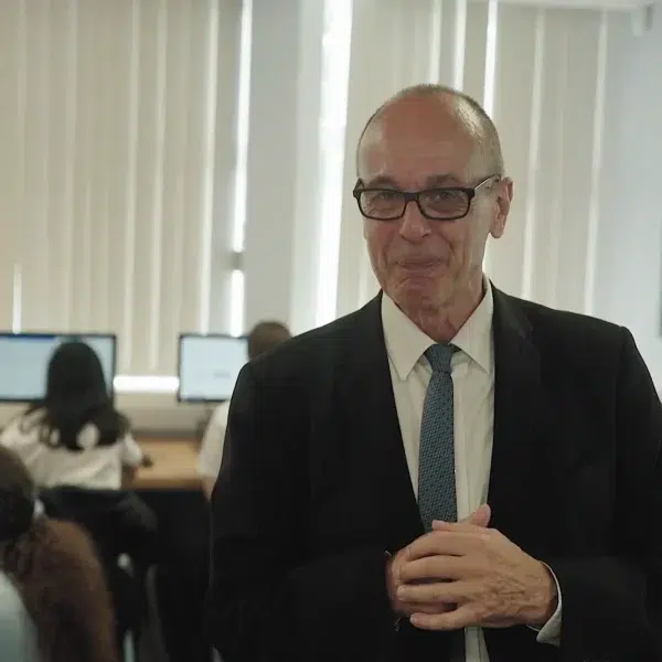 Presenter talking to camera in classroom