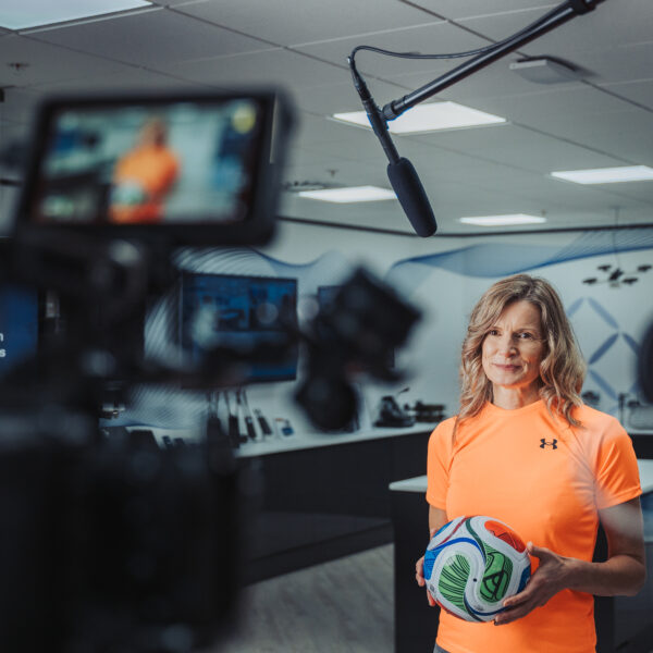 Promotional video production filming a sports presenter on camera for a corporate client in the UK