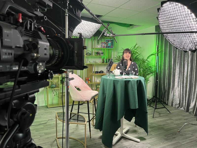 Corporate video presenter filmed in podcast studio with LED lighting - Zealous Media