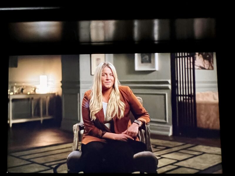 Camera monitor showing woman presenter during corporate video interview - Zealous Media