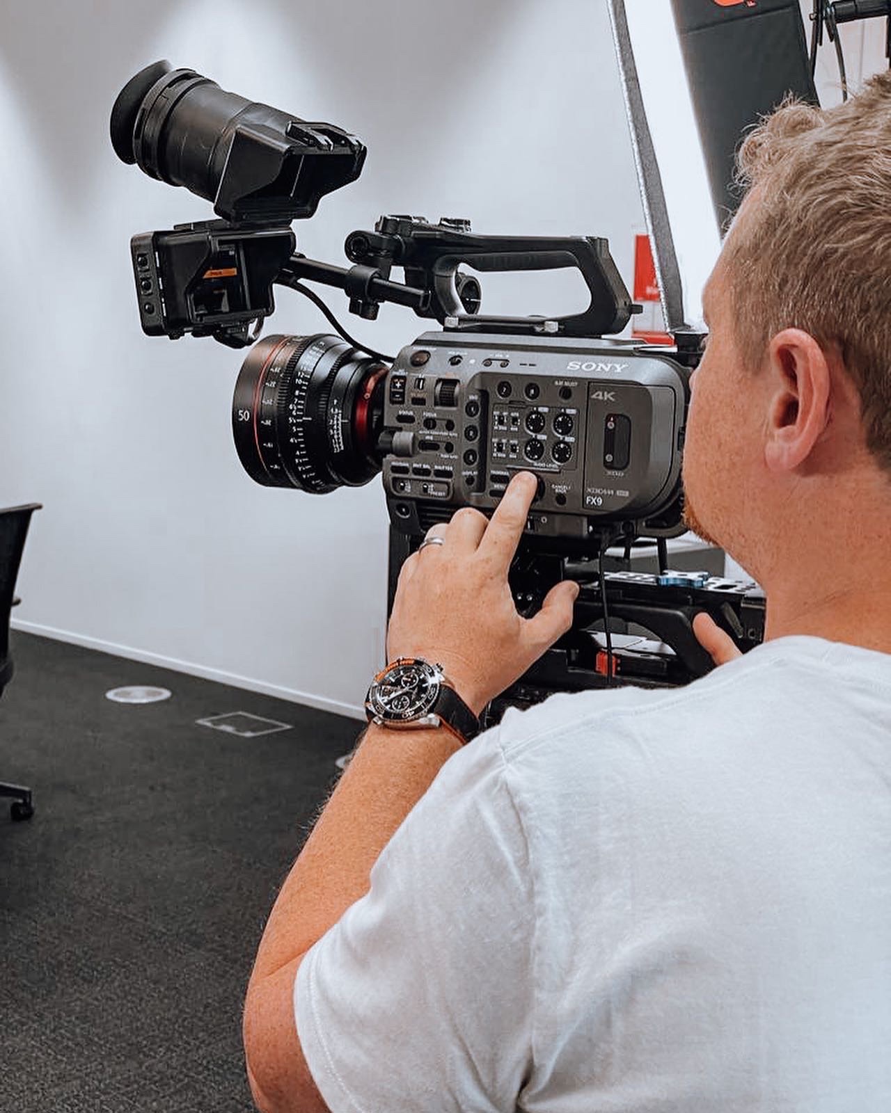 Cameraman operating Sony FX9 cinema camera in studio setup - Zealous Media