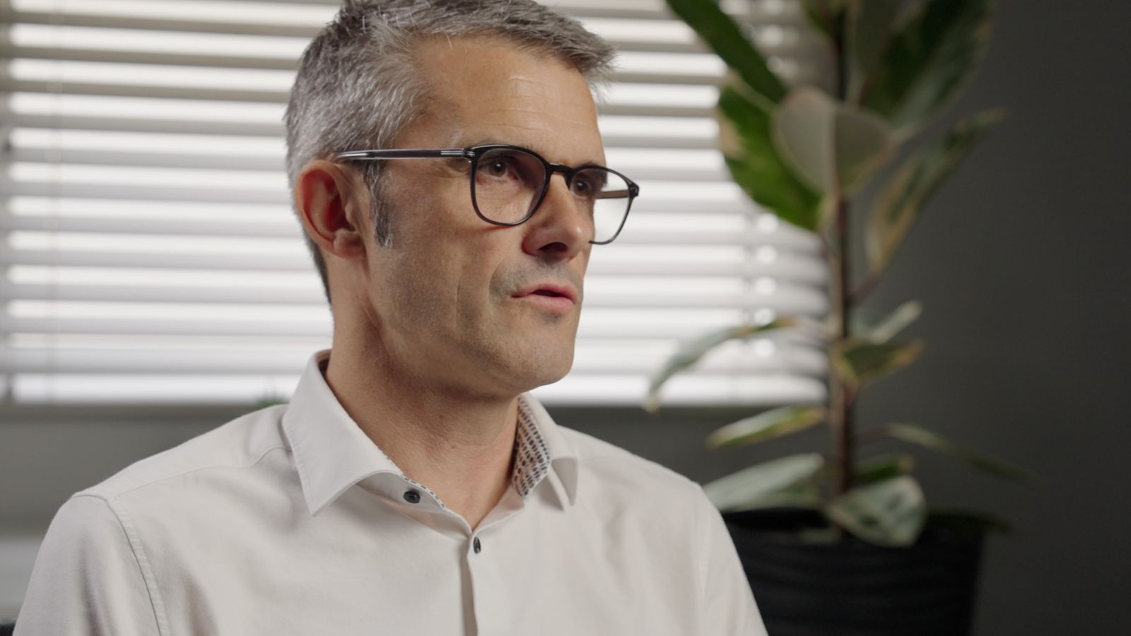 Corporate video interview shot of the subject framed off centre, the main camera angle