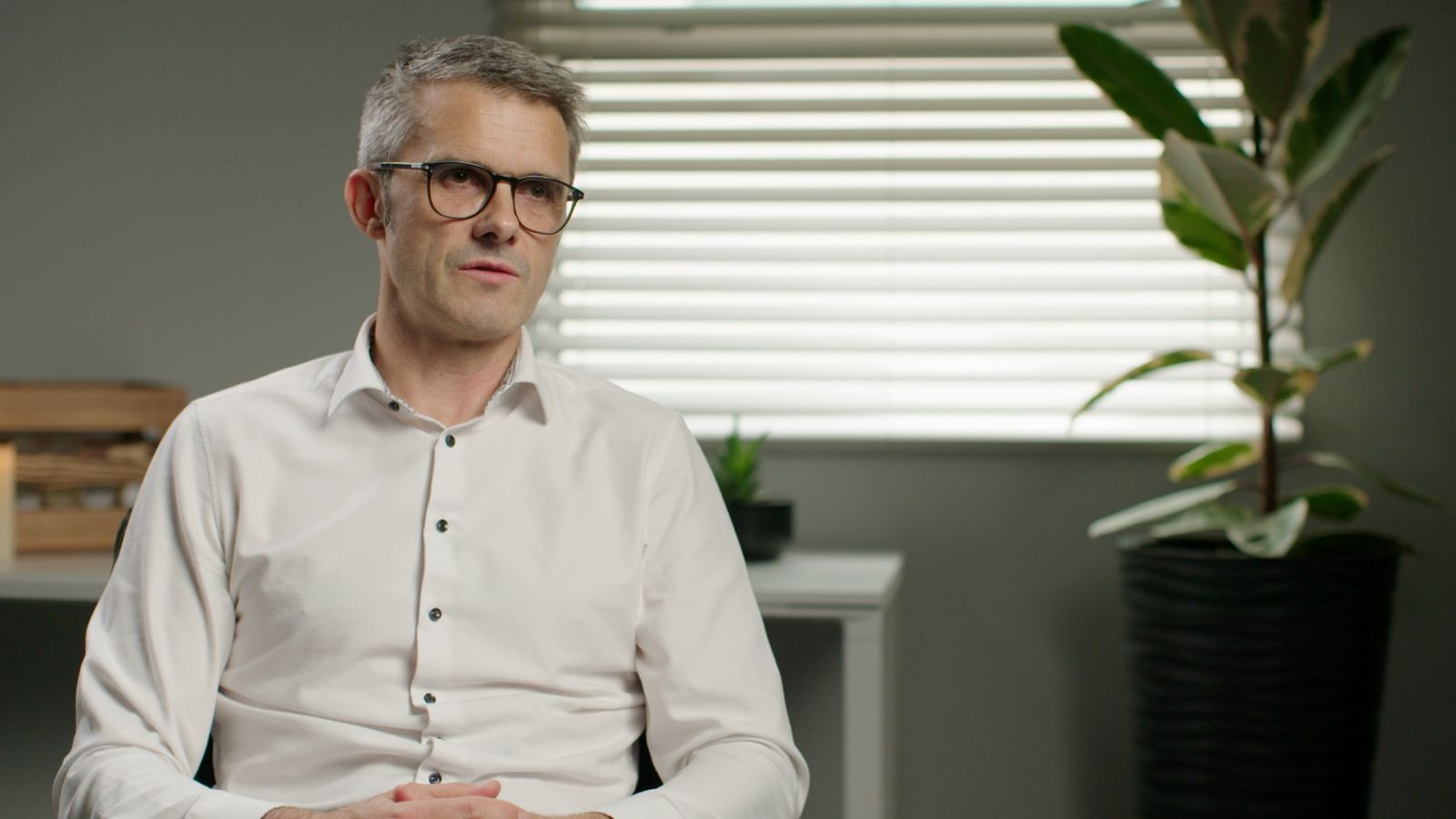 Corporate video interview cutaway shot, second camera framing the subject more centrally