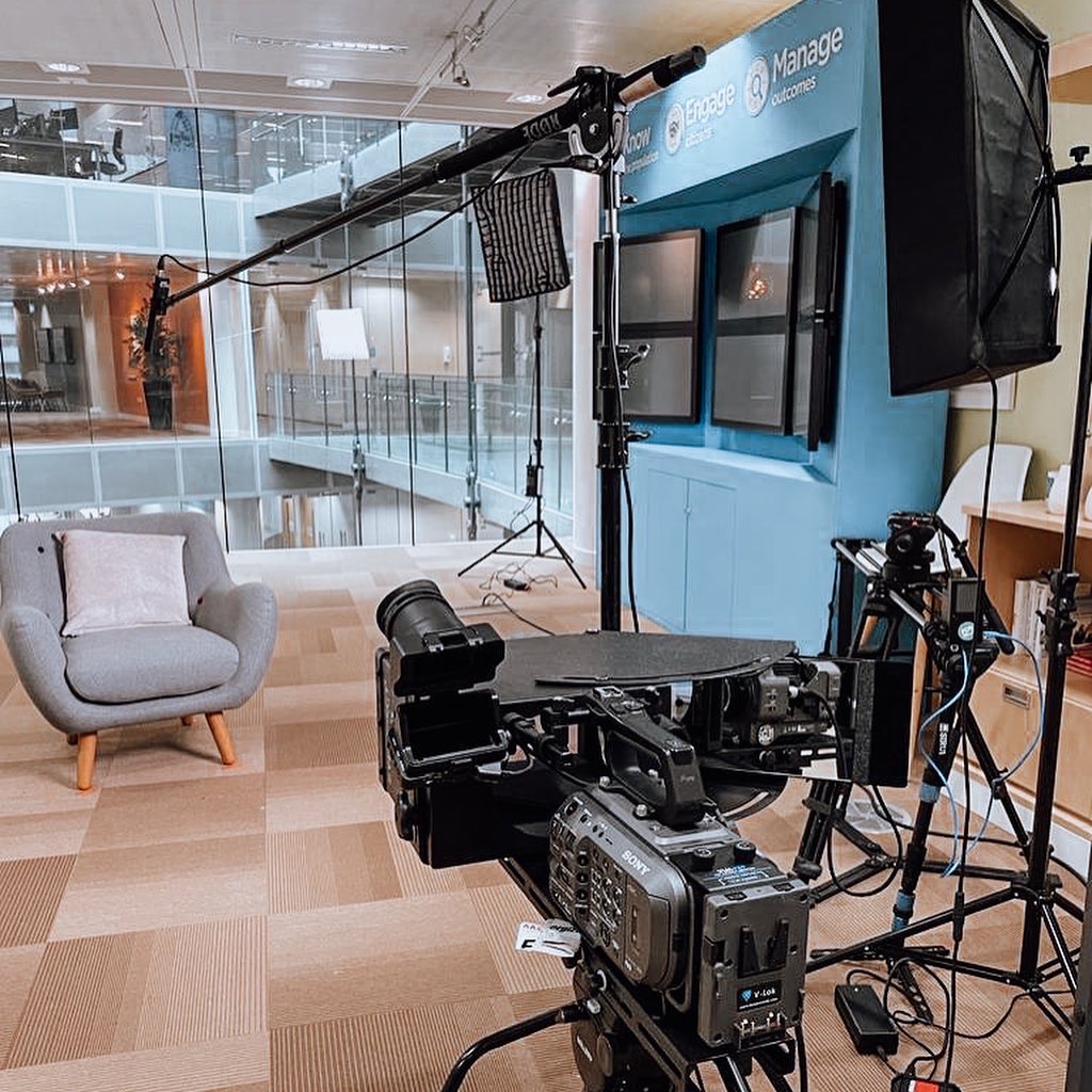 Corporate video interview setup with softbox lights and camera on location - Zealous Media