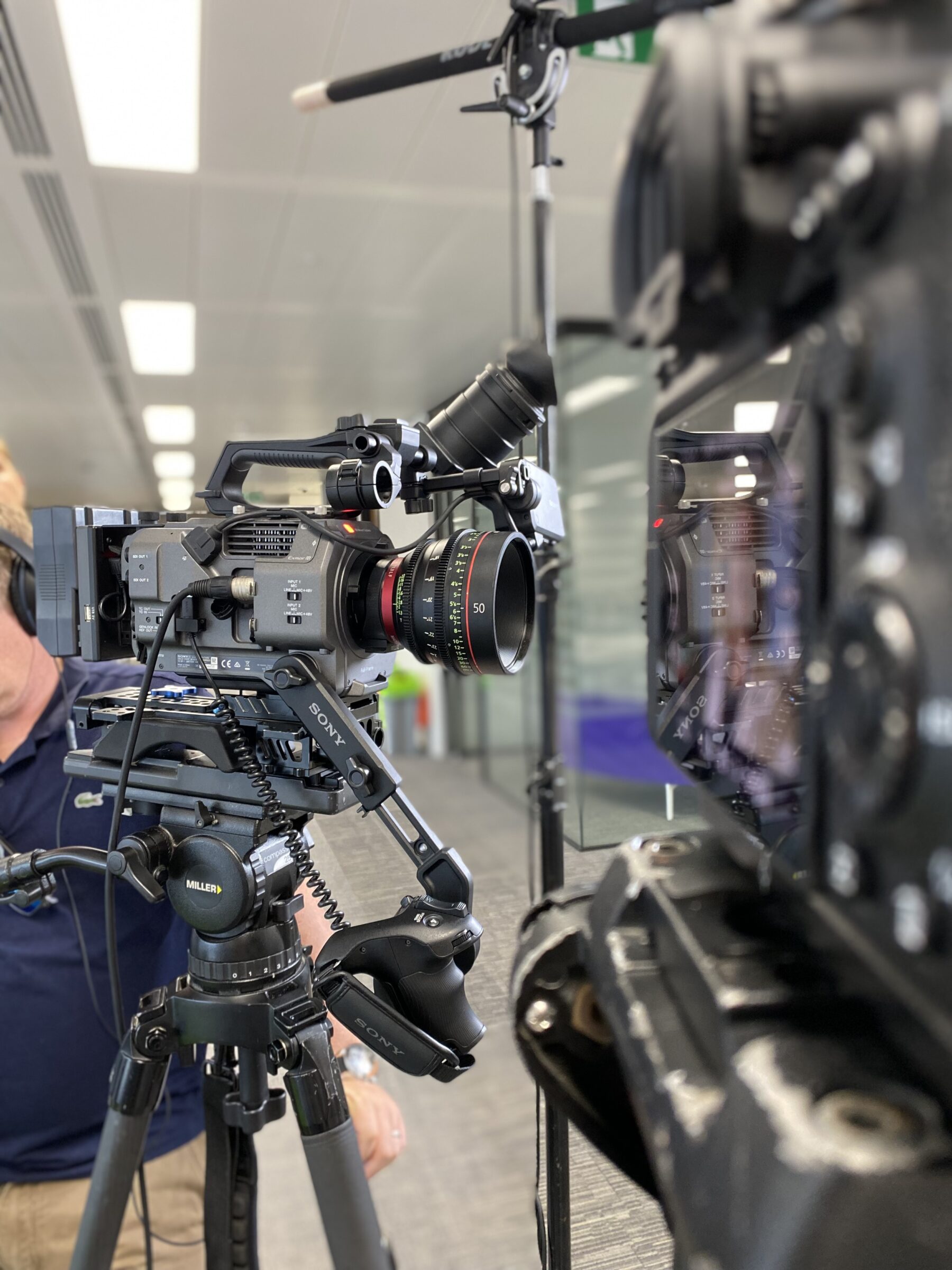 Dual Sony FX9 cameras with boom mic set up for corporate office video shoot - Zealous Media