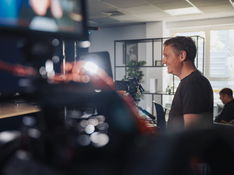 cameraman filming interview linksys office